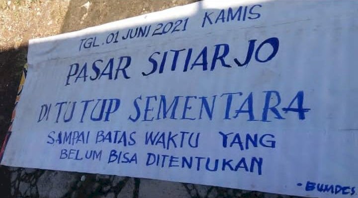 Banner Penutupan Pasar Sitiarjo, Kabupaten Malang/Ist