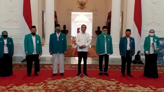 Farid Okbah saat berkunjung ke Istana Negara bersama Parmusi dan berfoto bareng Presiden Joko Widodo/Net